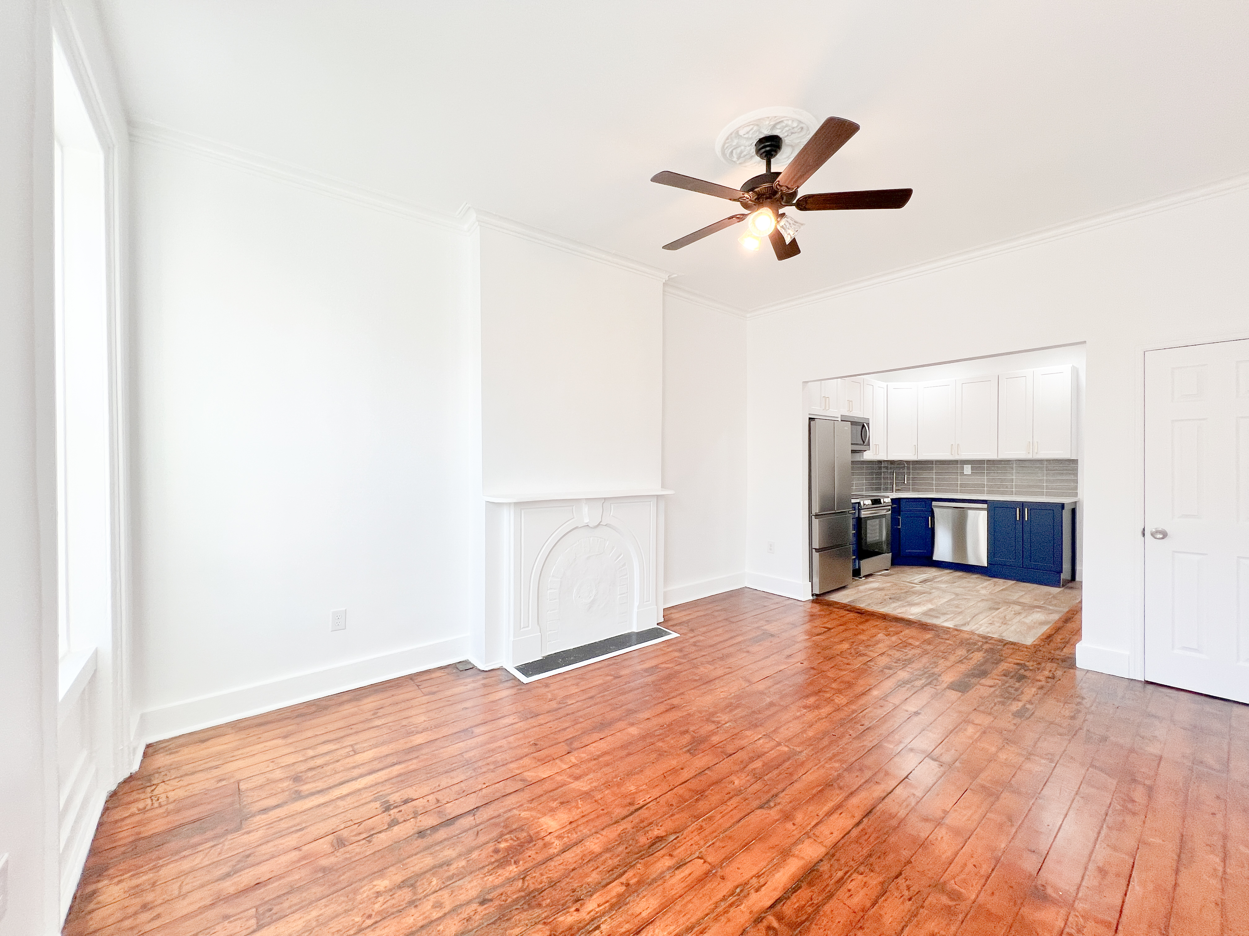 556 Vanderbilt Avenue, Unit 2 Brooklyn, NY 11238 - Photo 3 of 14 a view of empty room with wooden floor and ceiling fan