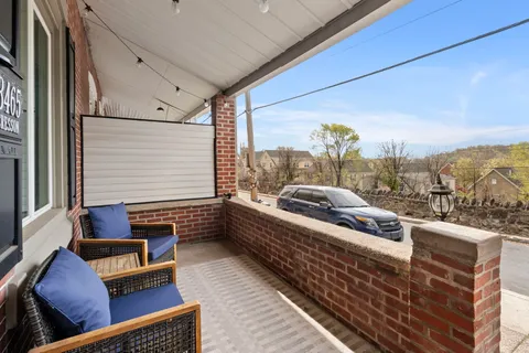 a view of roof deck with furniture