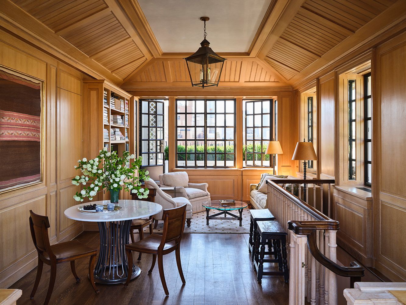 a view of a dining room with furniture and a chandelier