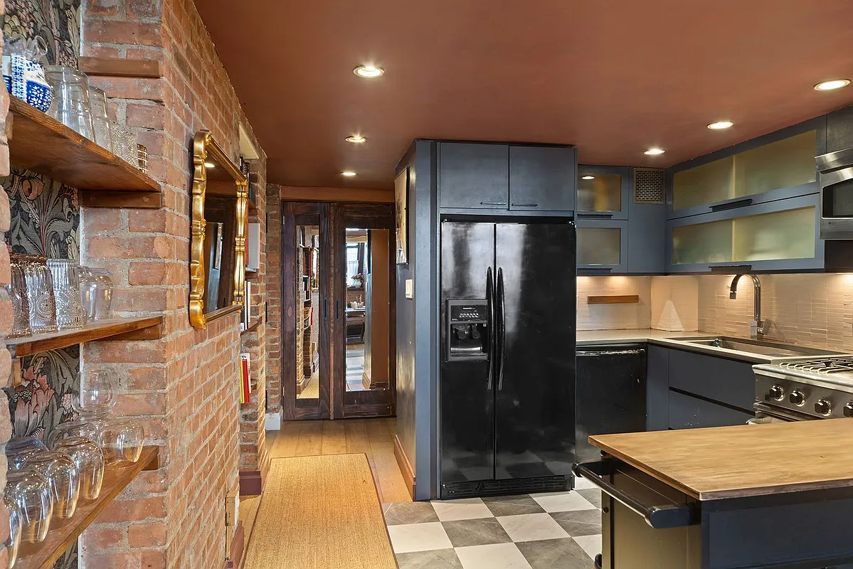 300 East 4th Street, Unit 1A Manhattan, NY 10009 - Photo 3 of 10 a kitchen with stainless steel appliances granite countertop a refrigerator a sink and a stove