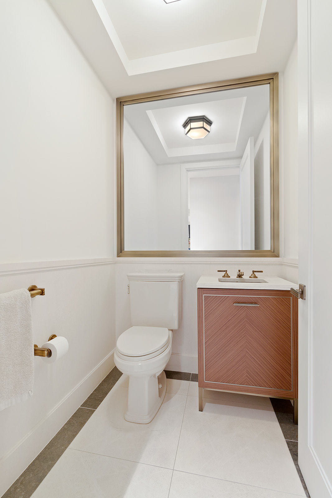 100 Barclay Street, Unit 13K Manhattan, NY 10007 - Photo 6 of 11 a bathroom with a toilet sink and mirror