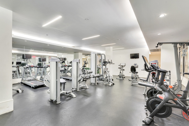 303 East 33rd Street, Unit 7N Manhattan, NY 10016 - Photo 11 of 15 a view of a room with gym equipment
