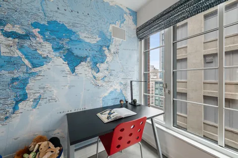 a balcony with table and chairs