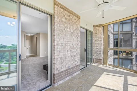 a view of a bathroom with a glass door shower and a sink
