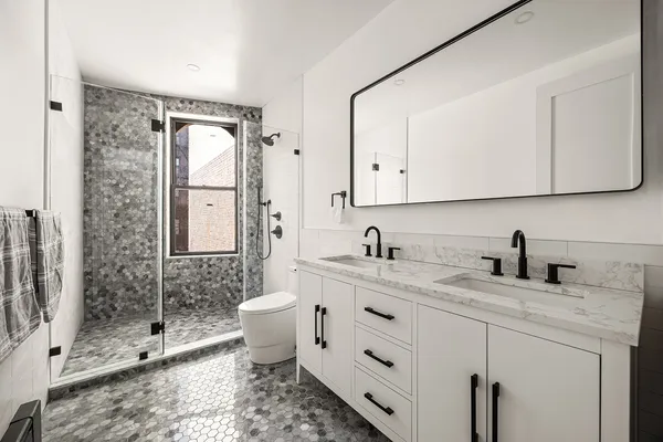 a utility room with sink dryer and washer