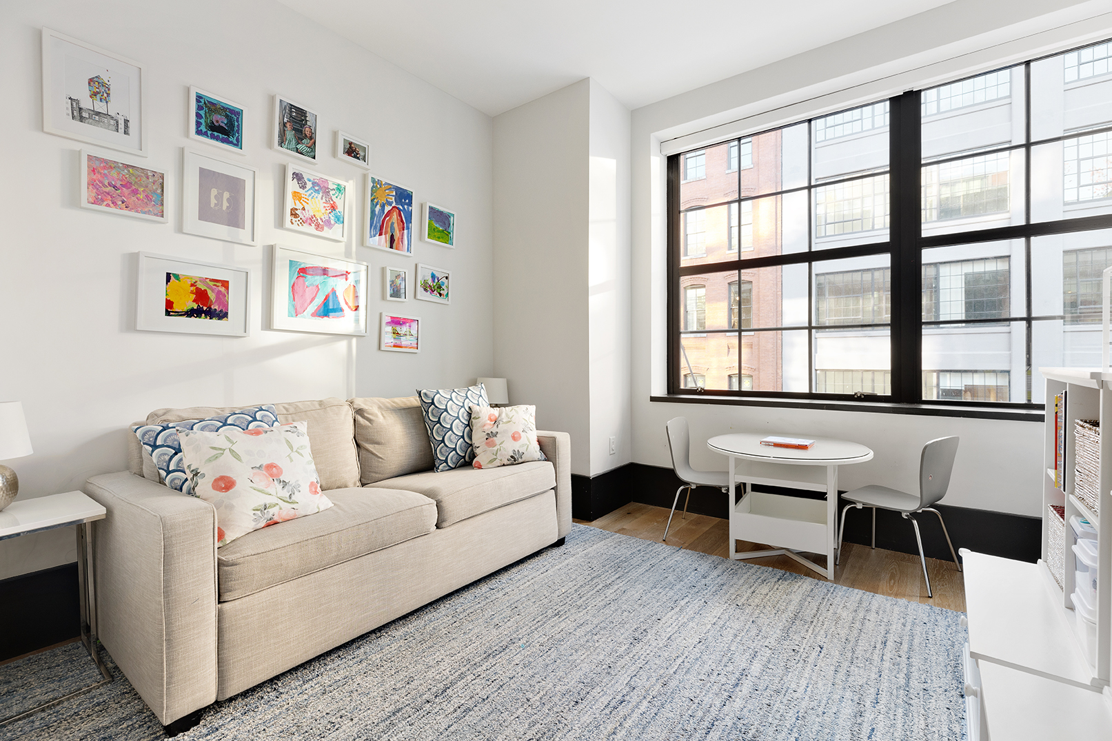 51 Jay Street, Unit 3C Brooklyn, NY 11201 - Photo 9 of 10 a living room with furniture and a window with wooden floor