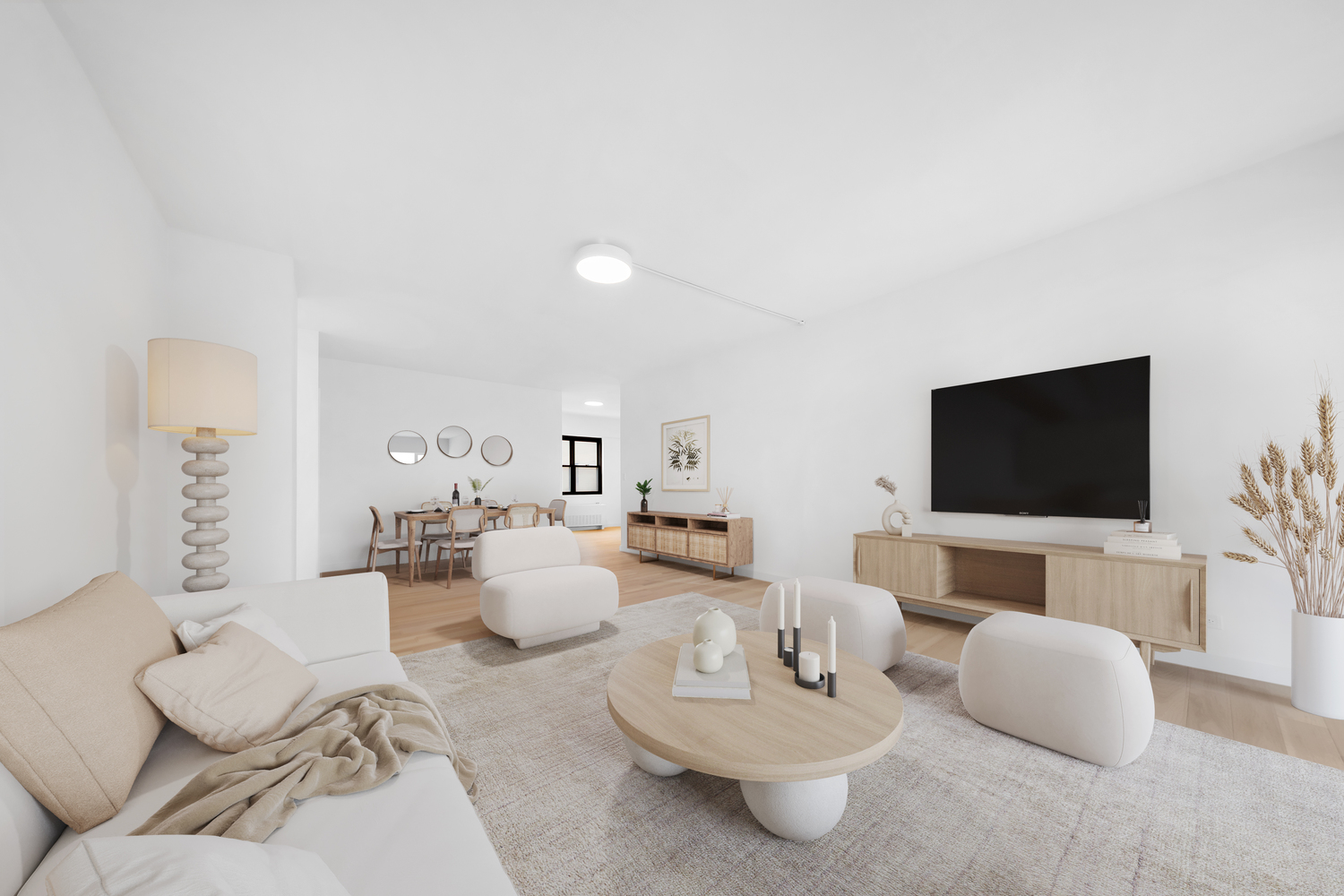 58 West 58th Street, Unit 21C Manhattan, NY 10019 - Photo 3 of 12 a living room with furniture and a flat screen tv