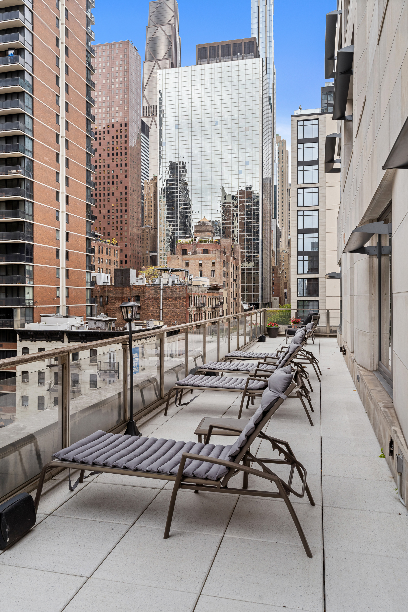 301 East 50th Street, Unit 5A Manhattan, NY 10022 - Photo 12 of 19 a view of balcony with couch and chairs