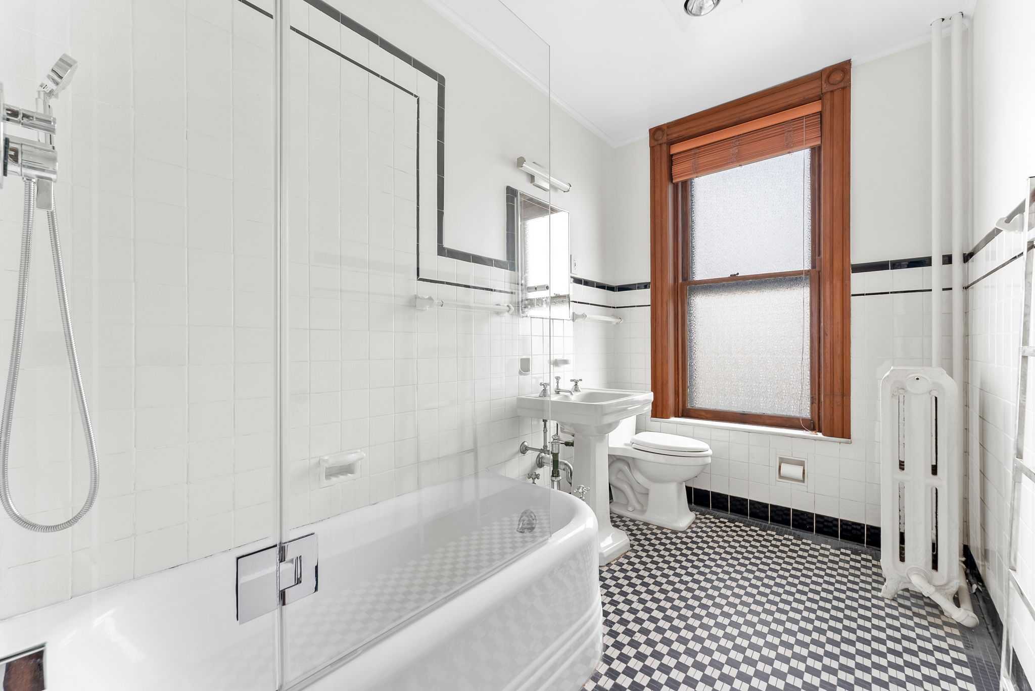 694 10th Street, Unit 2 Brooklyn, NY 11215 - Photo 11 of 22 a bathroom with a sink a toilet and a bathtub