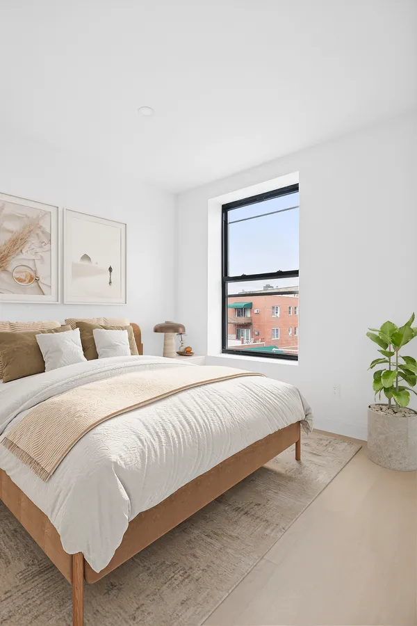 a bedroom with bed and a window