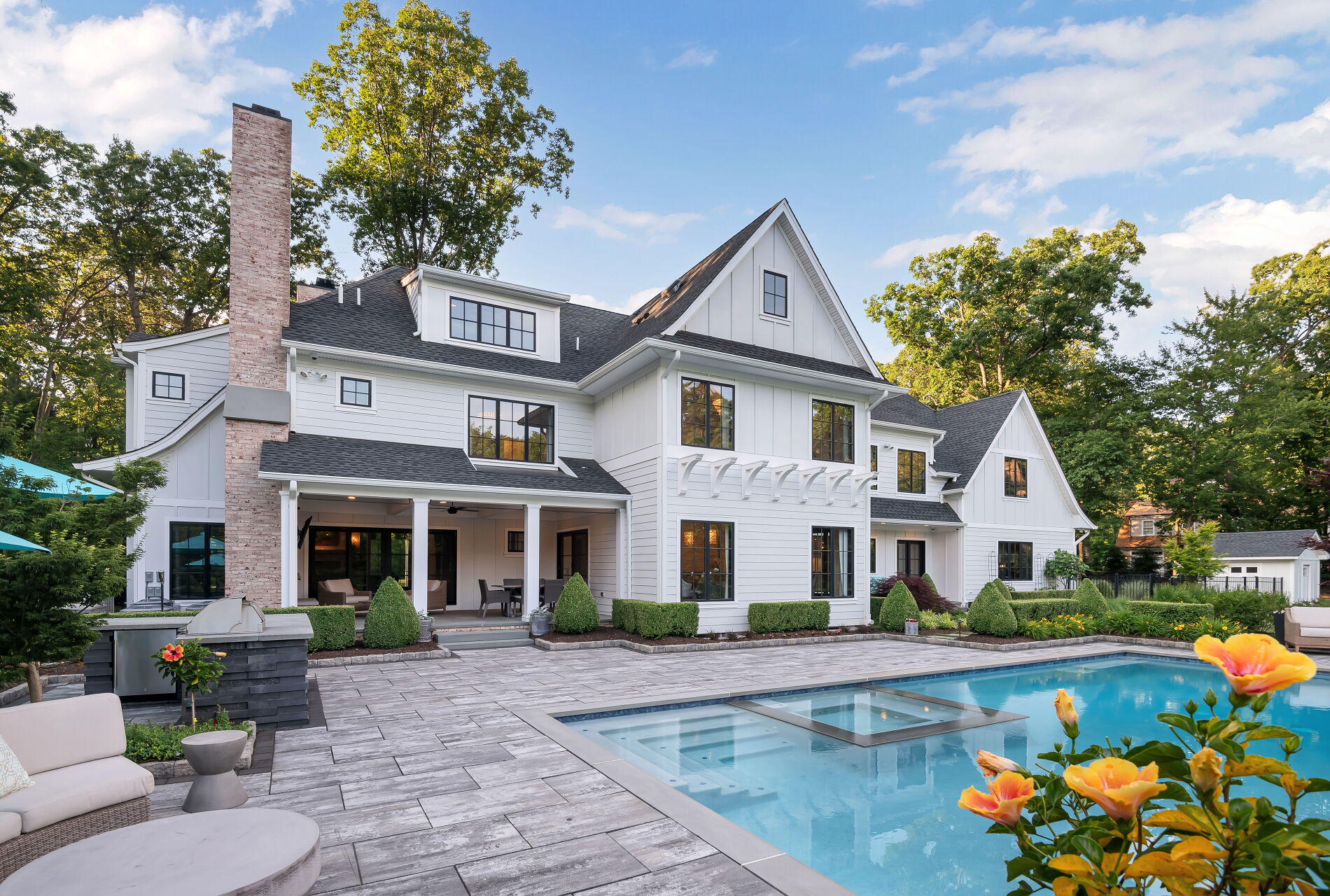838 Seneca Road Franklin Lakes, NJ 07417 - Photo 6 of 92 a front view of a house with swimming pool having outdoor seating