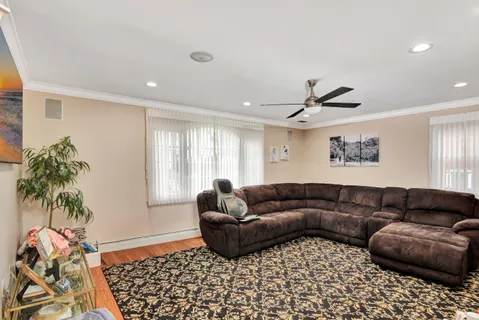 a living room with furniture and a window