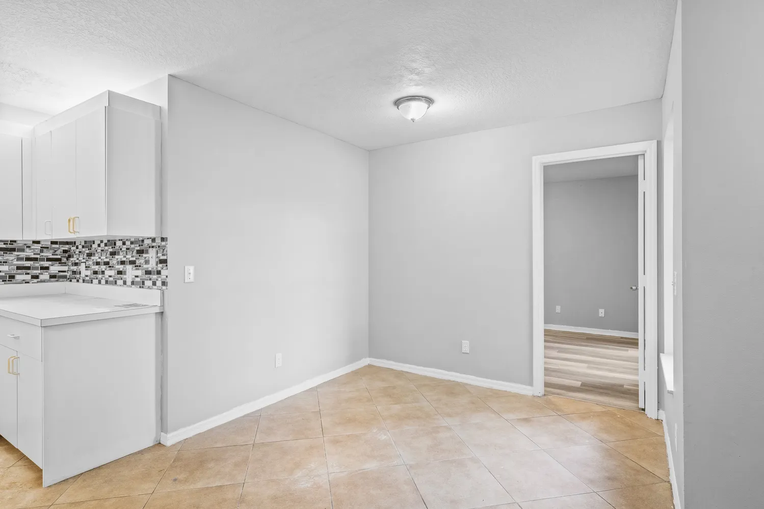 a view of room with walk in closet and window