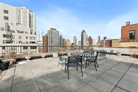 a view of a terrace with chairs