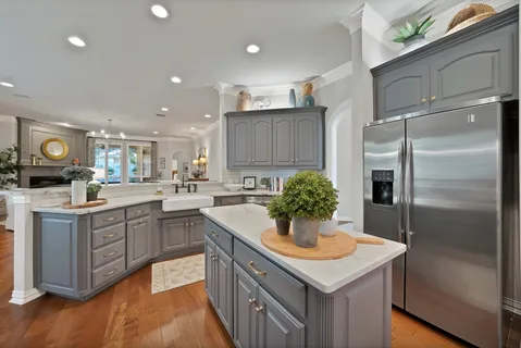 a kitchen with a sink and refrigerator