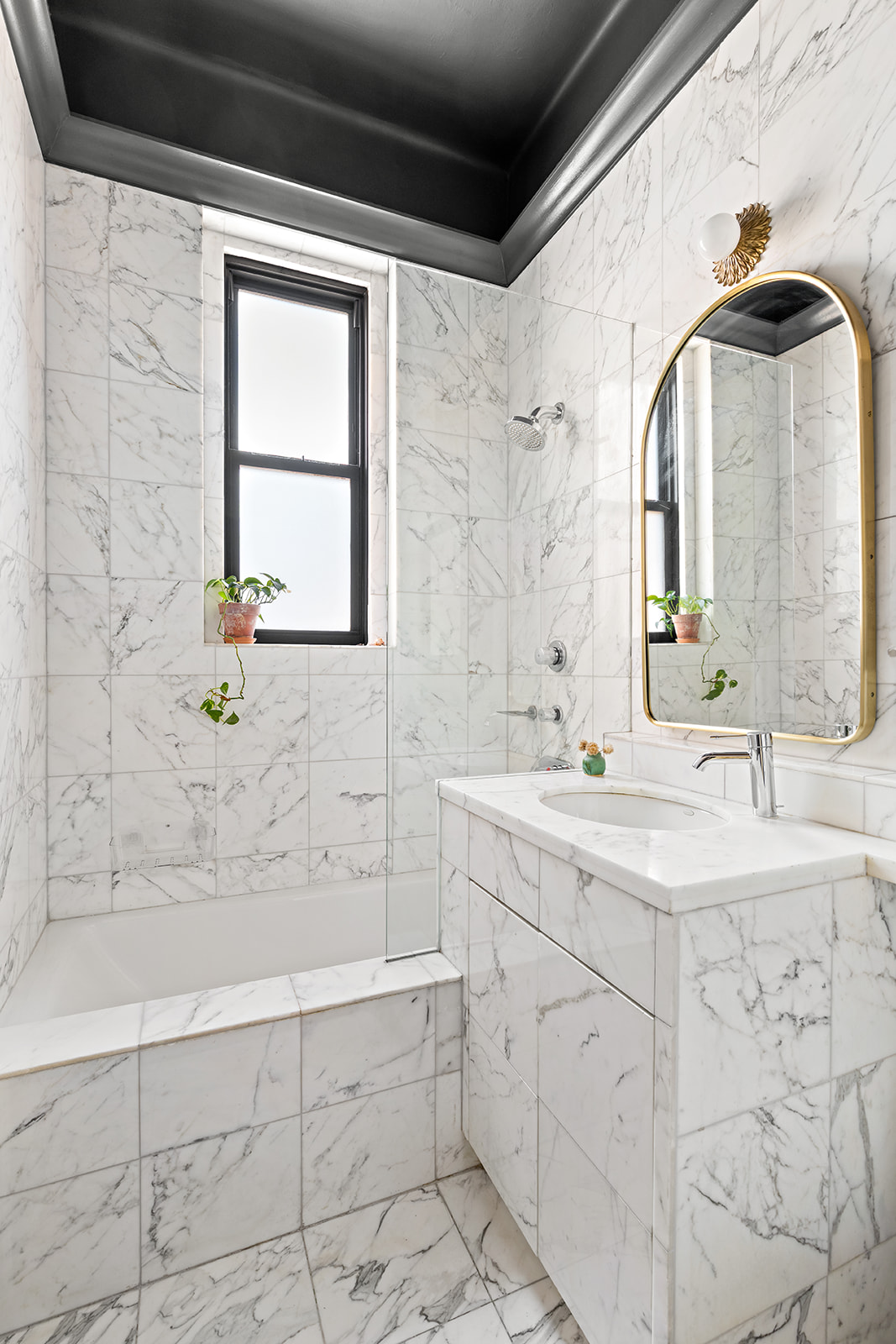 151 East 83rd Street, Unit PHB Manhattan, NY 10028 - Photo 7 of 11 a bathroom with a granite countertop sink a toilet and a bathtub