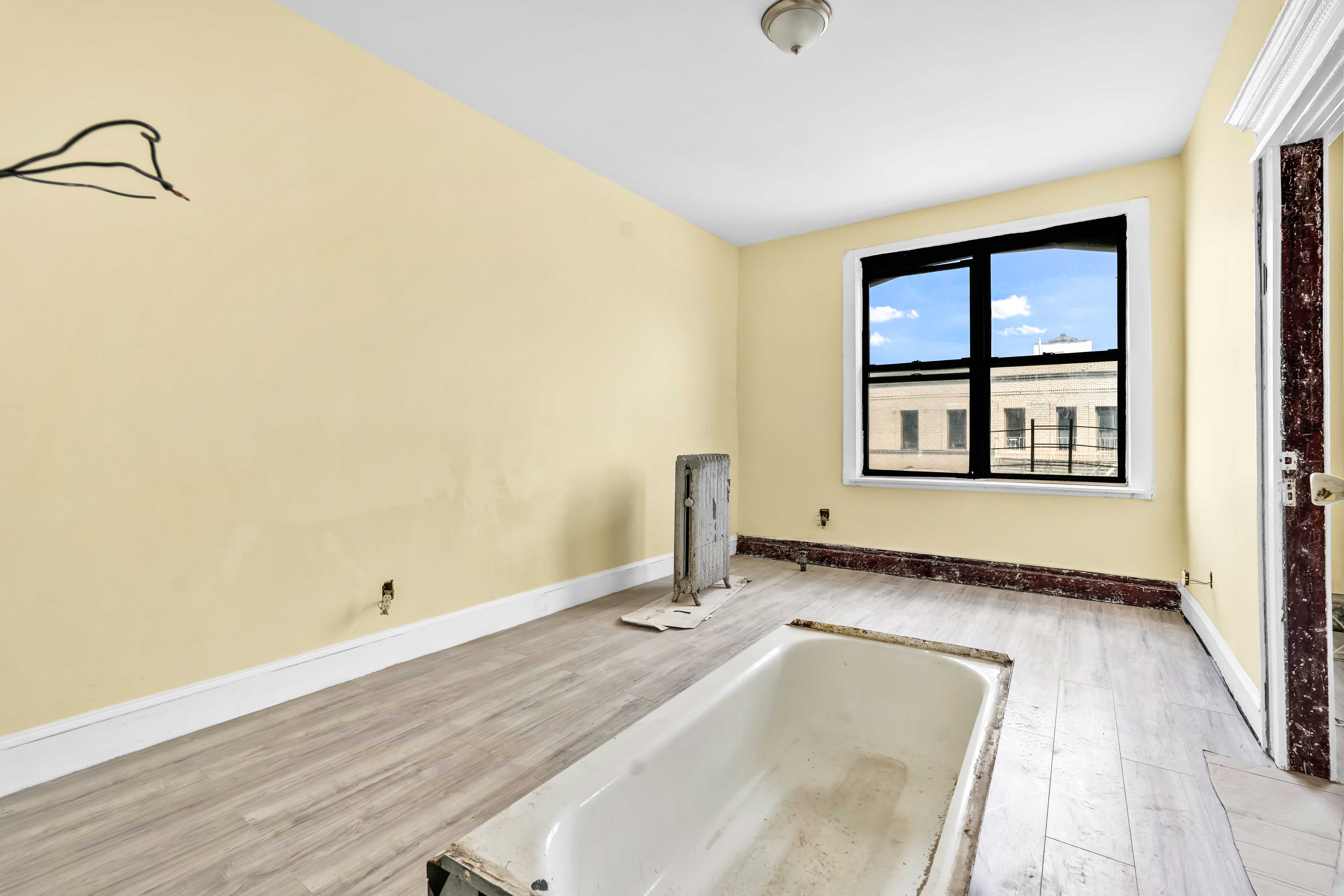 1770 Bedford Avenue Brooklyn, NY 11225 - Photo 23 of 50 a bathroom with a tub and shower