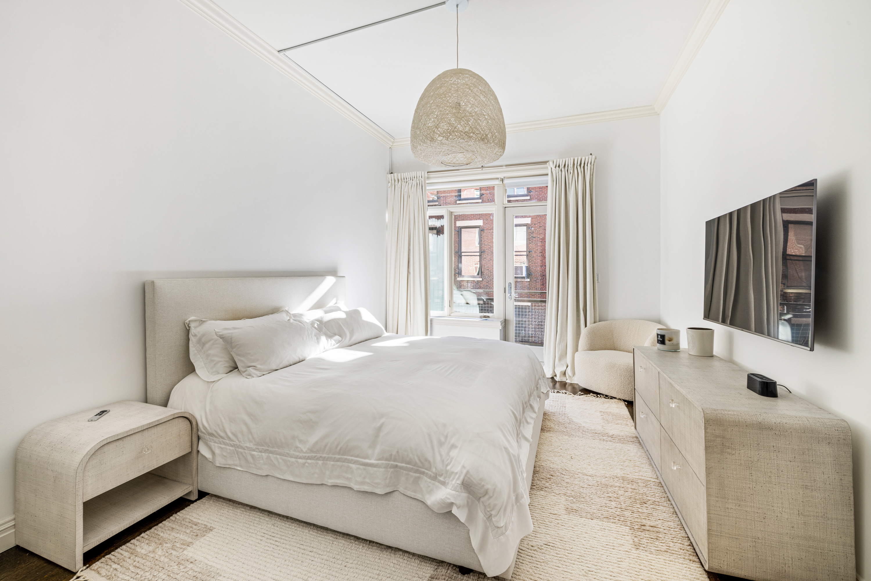 51 Walker Street, Unit 6B Manhattan, NY 10013 - Photo 7 of 10 a bedroom with a large bed and a large mirror