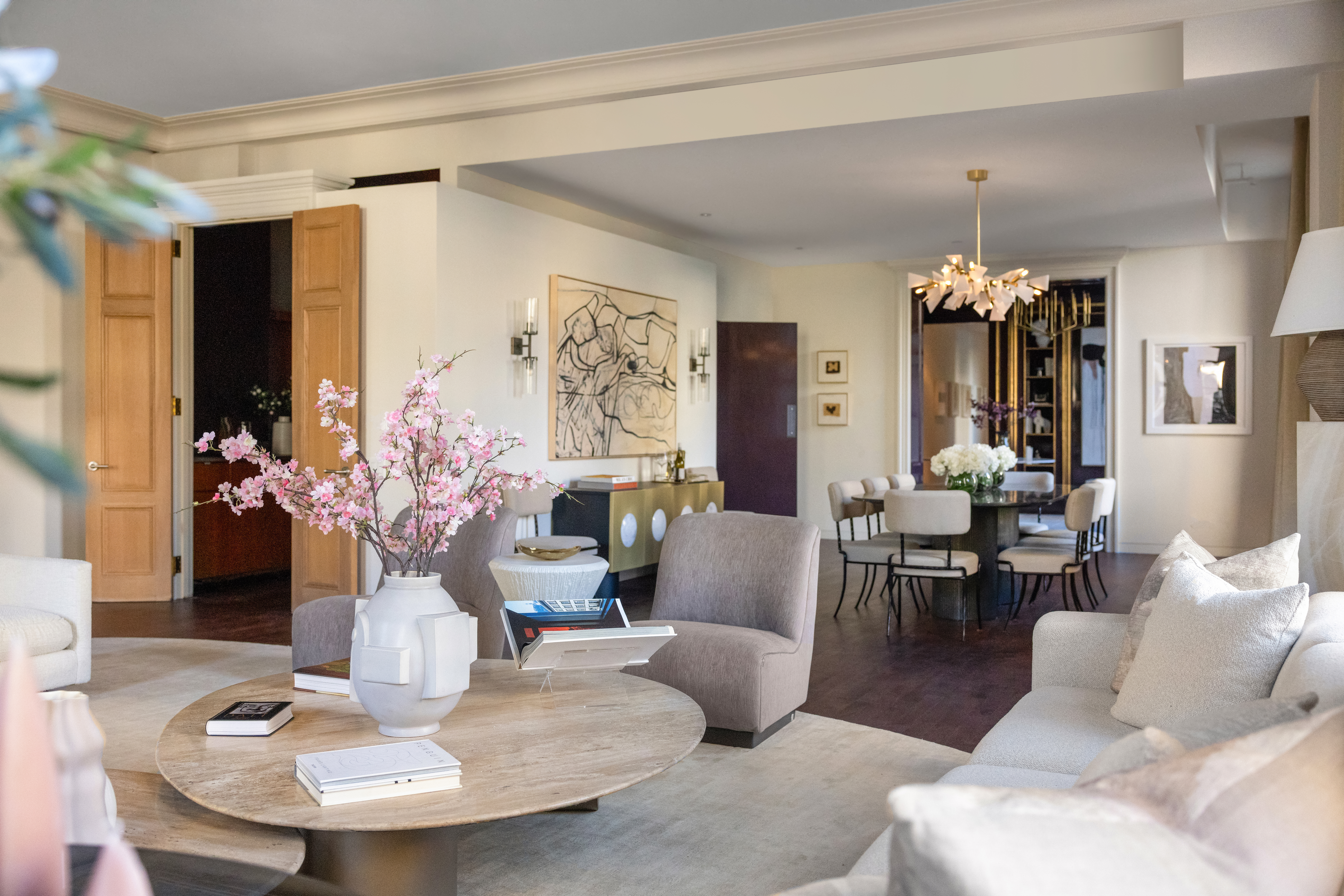 170 5th Avenue, Unit 5 Manhattan, NY 10010 - Photo 7 of 22 a living room with furniture and a chandelier