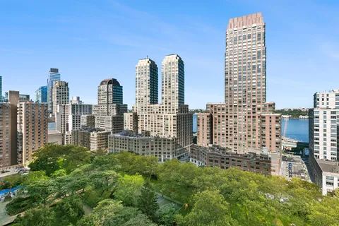 a view of city with tall buildings
