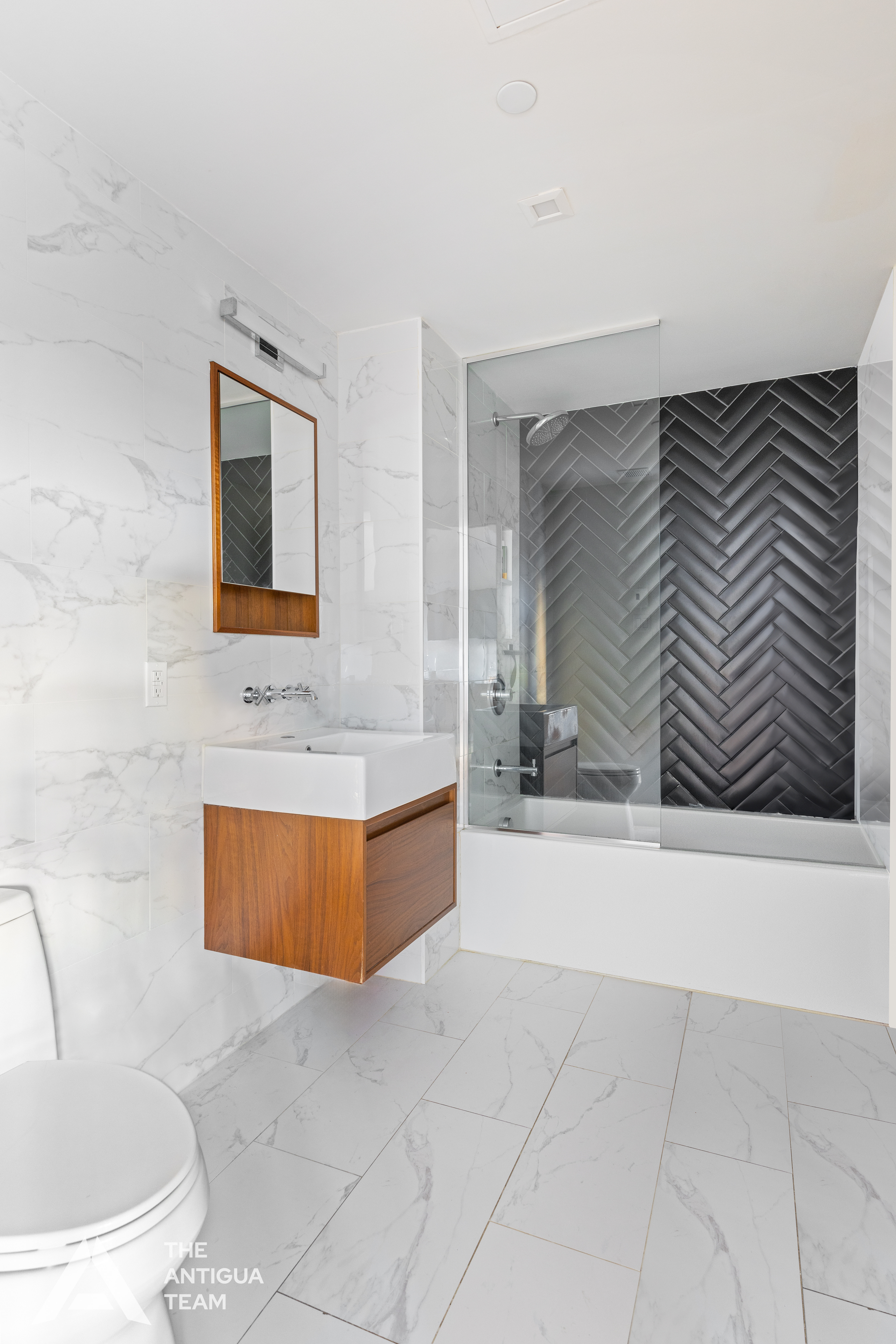 167 Eagle Street, Unit 1B Brooklyn, NY 11222 - Photo 7 of 13 a bathroom with a bathtub and a sink