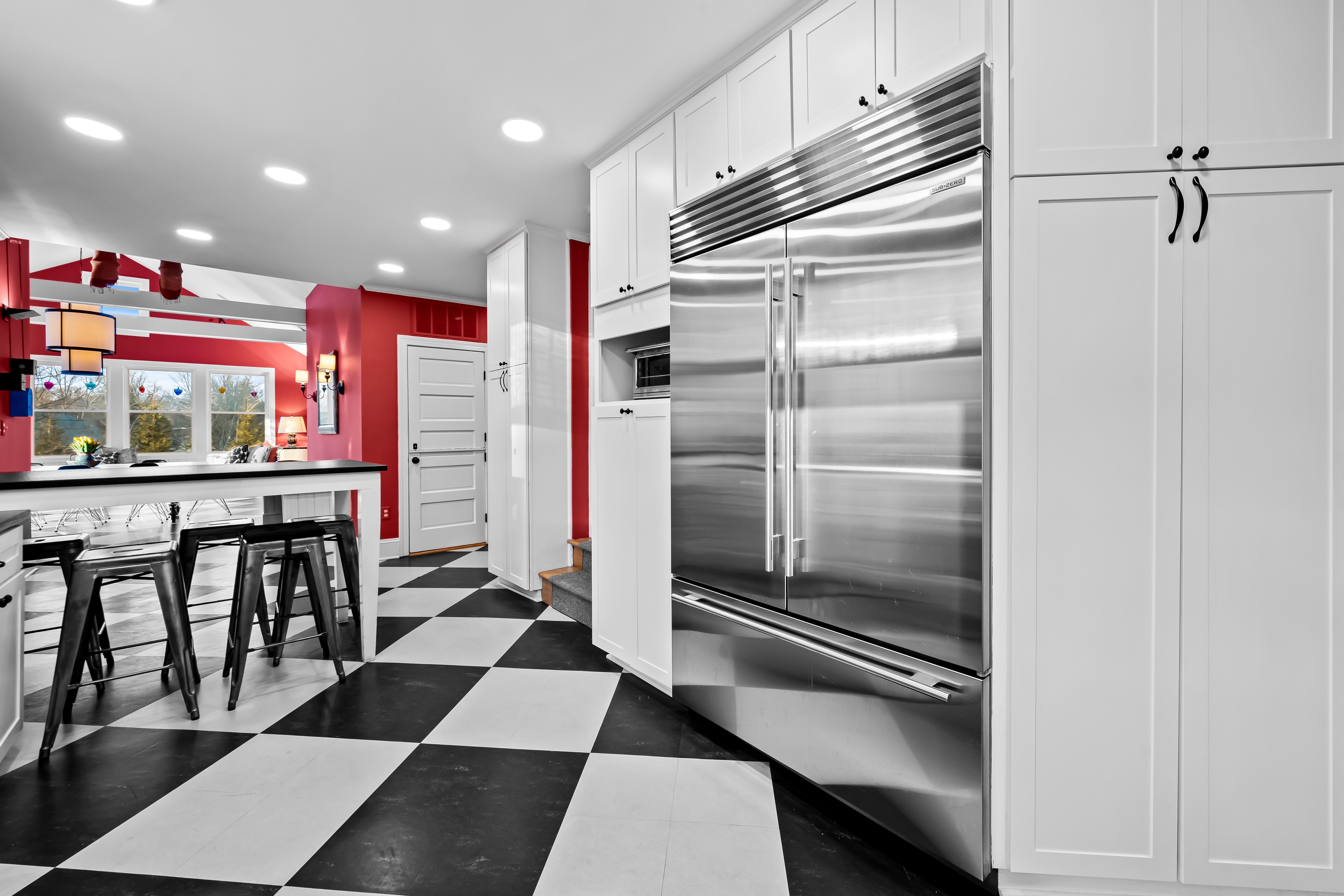 8412 Stevenson Road Pikesville, MD 21208 - Photo 38 of 81 a kitchen with stainless steel appliances kitchen island granite countertop a refrigerator and a sink