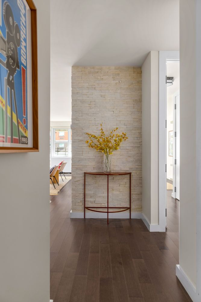 a view of staircase with a rug and a window