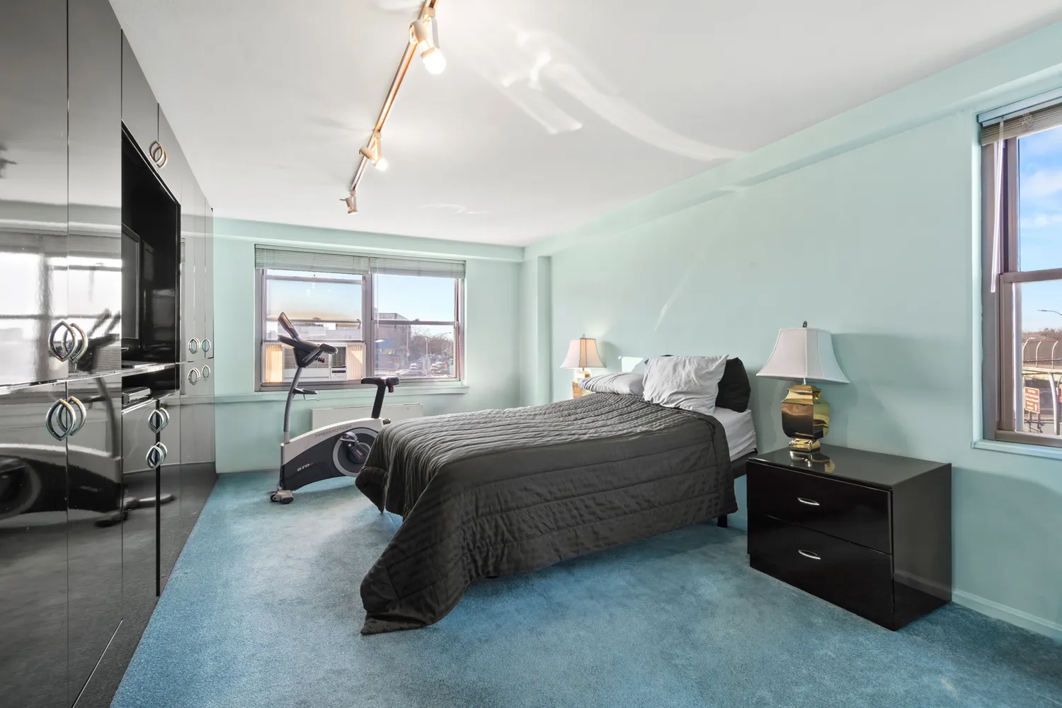 a bedroom with a bed and a couch