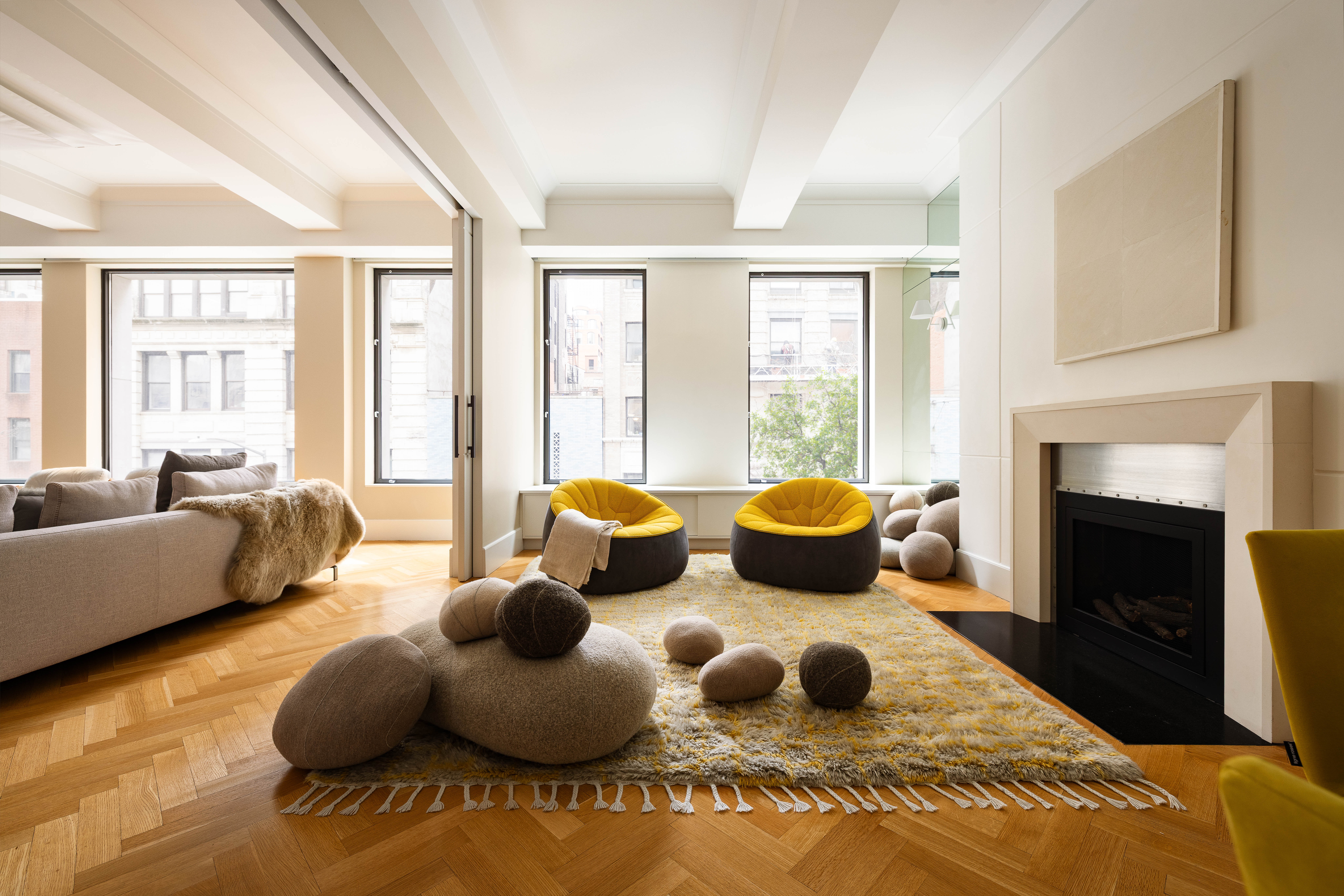 17 East 12th Street, Unit 3 Manhattan, NY 10003 - Photo 11 of 27 a bedroom with furniture and a fireplace