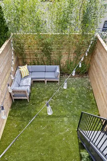a garden view with a seating space
