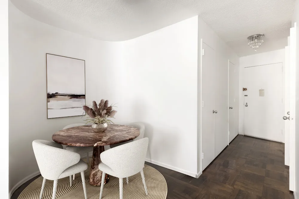 a view of a dining room with furniture and wooden floor