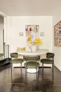 a view of a workspace with furniture and wooden floor