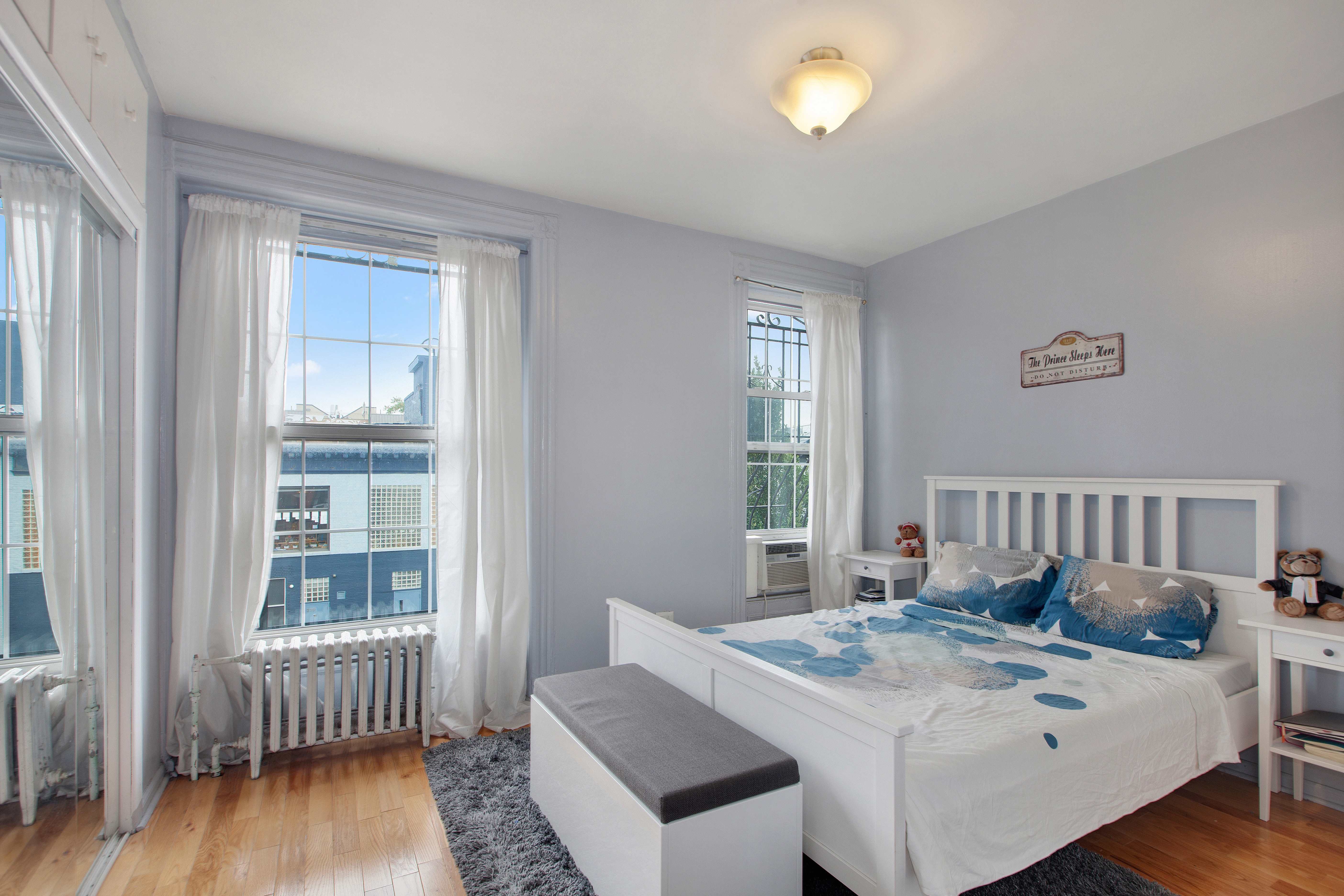 250 Saint Marks Avenue, Unit 3 Brooklyn, NY 11238 - Photo 4 of 8 a view of bedroom with a bed and wooden floor