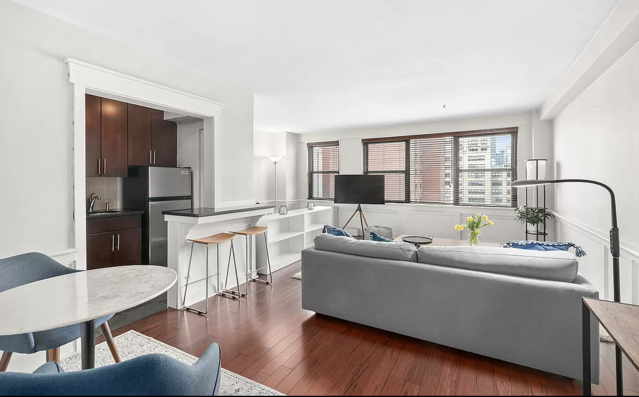 200 East 27th Street, Unit 12J Manhattan, NY 10016 - Photo 1 of 8 a living room with furniture and a large window