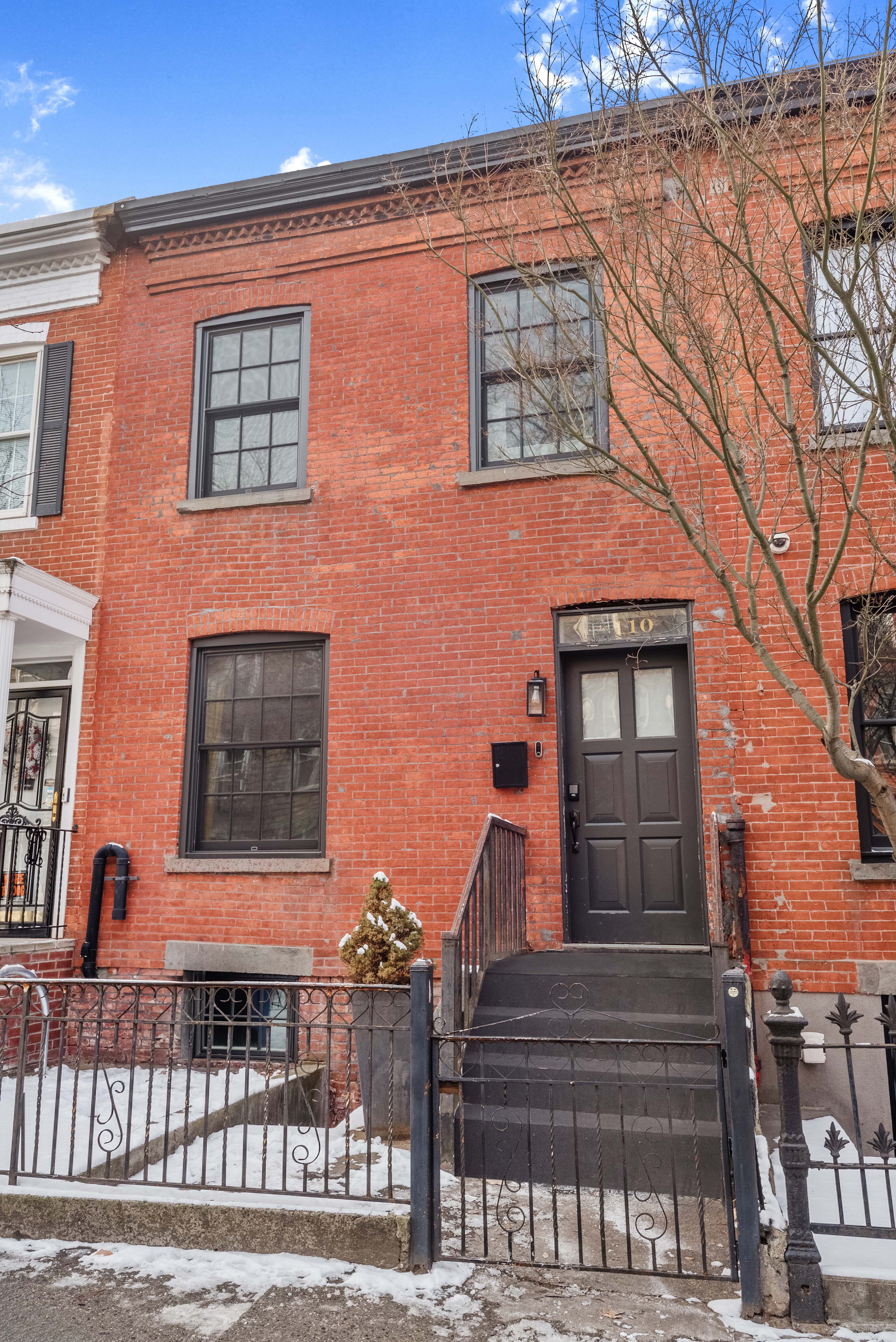 110 North 9th Street, Unit TH1 Brooklyn, NY 11249 - Photo 13 of 14 a front view of a house with a yard