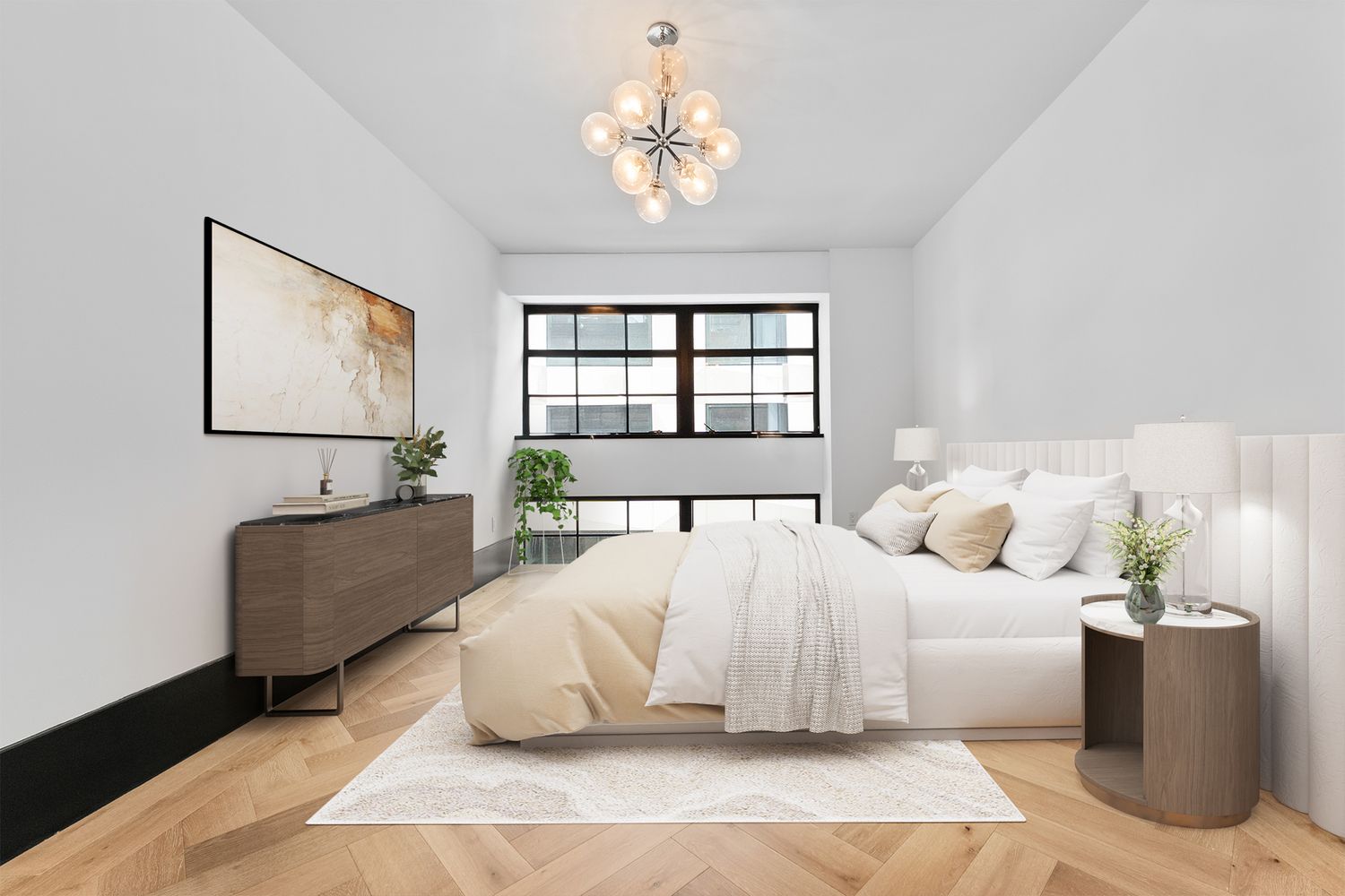 a bedroom with a large bed couch and a window