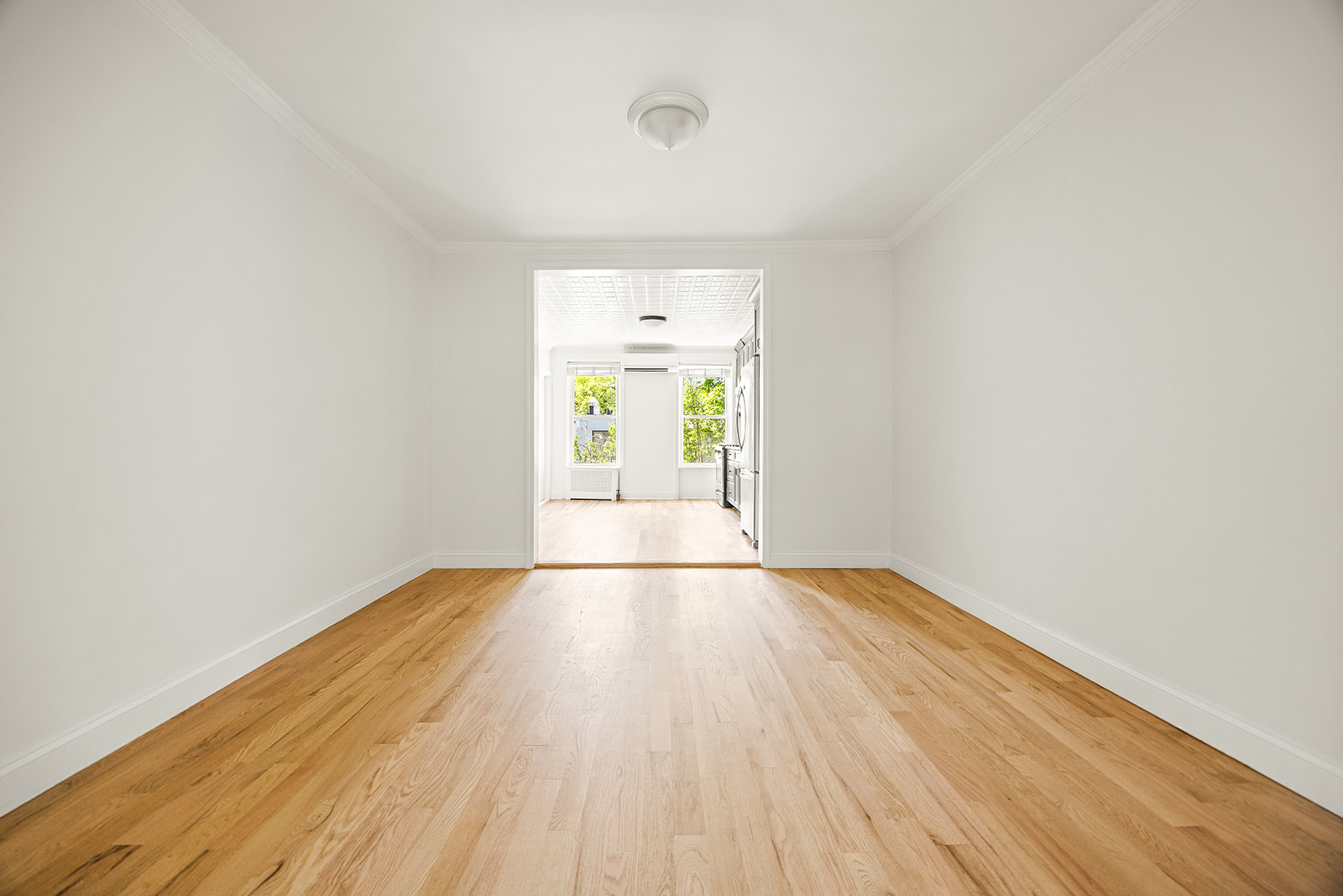 616 Carroll Street, Unit 2 Brooklyn, NY 11215 - Photo 7 of 15 an empty room with wooden floor and windows