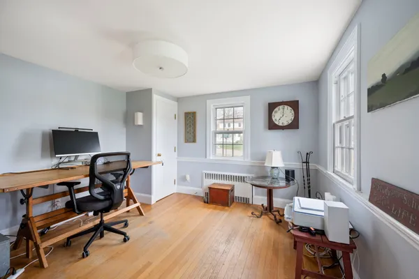 a workspace with furniture and a window