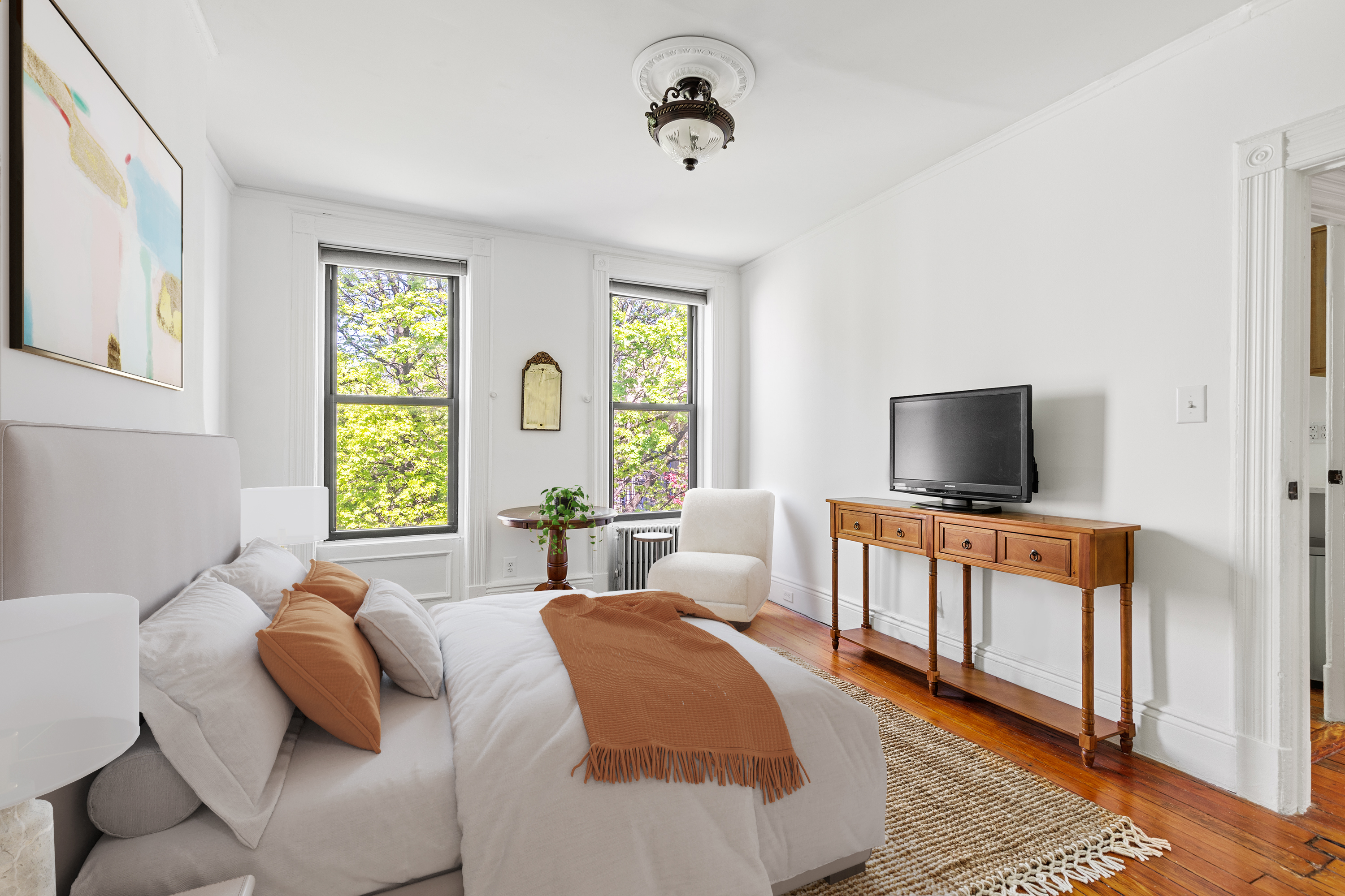 955 Bushwick Avenue Brooklyn, NY 11221 - Photo 6 of 19 a bedroom with furniture and a flat screen tv