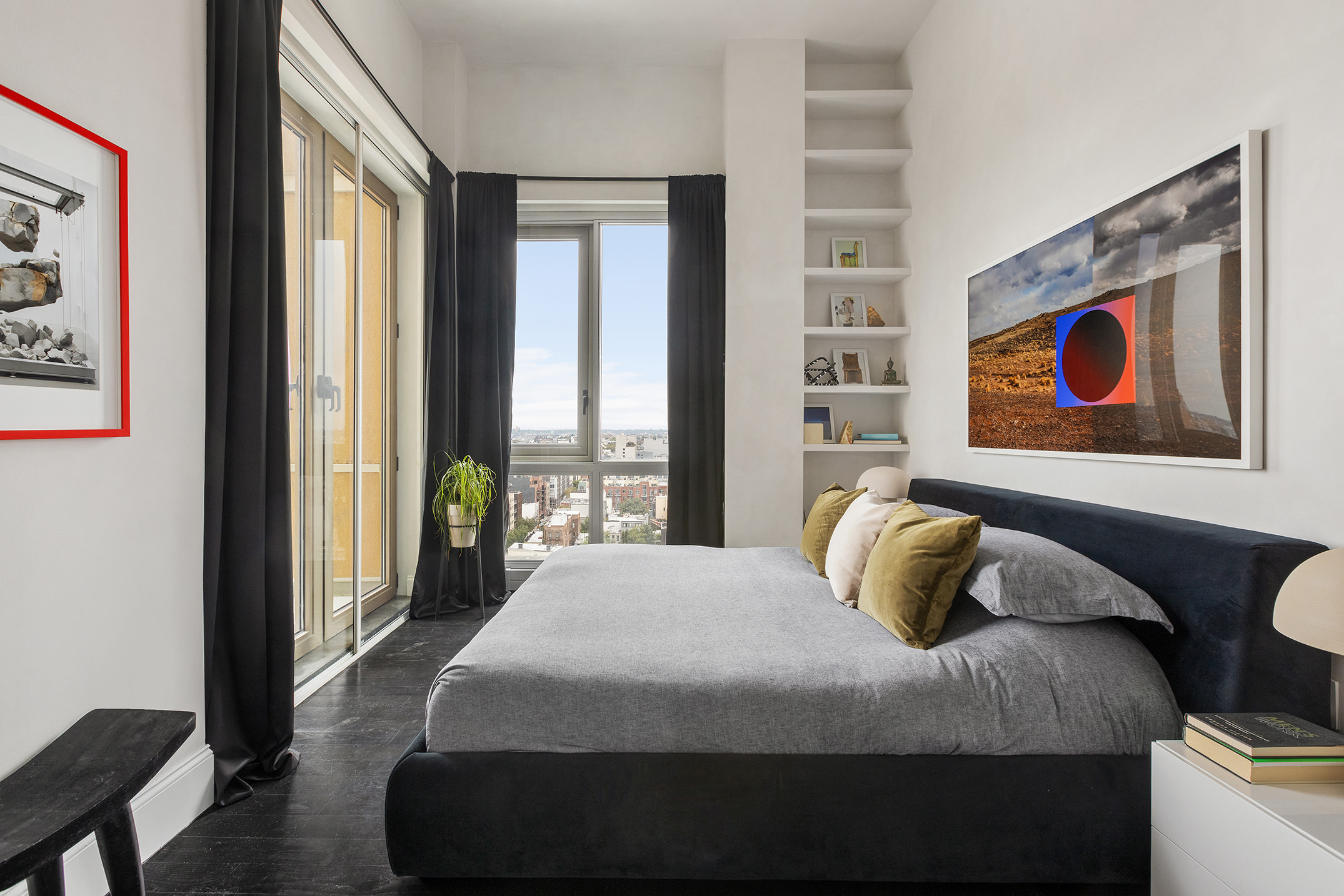 144 North 8th Street, Unit 12B Brooklyn, NY 11249 - Photo 9 of 15 a bedroom with a bed and a painting on the wall