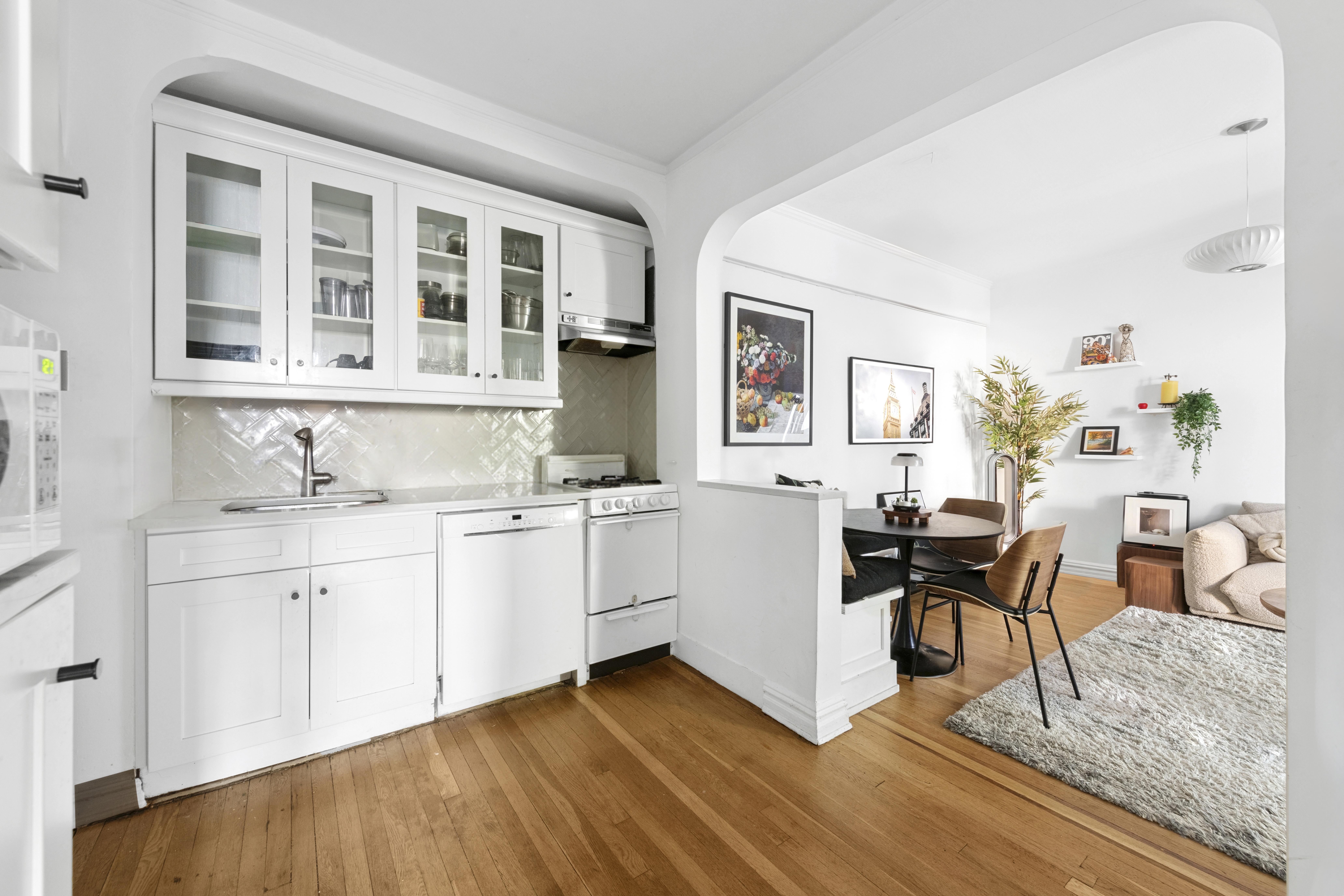 140 East 2nd Street, Unit 5F Brooklyn, NY 11218 - Photo 2 of 7 a view of a kitchen with granite countertop a stove and a sink