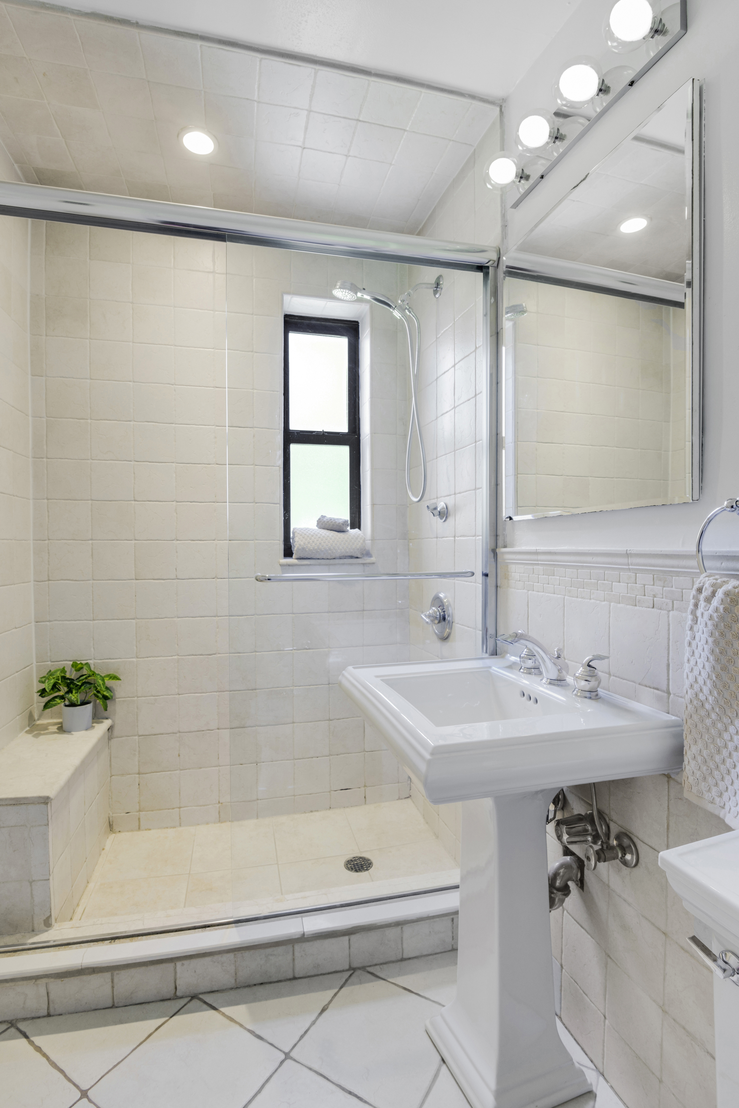 330 East 70th Street, Unit 4F Manhattan, NY 10021 - Photo 10 of 14 a bathroom with a sink a toilet and shower