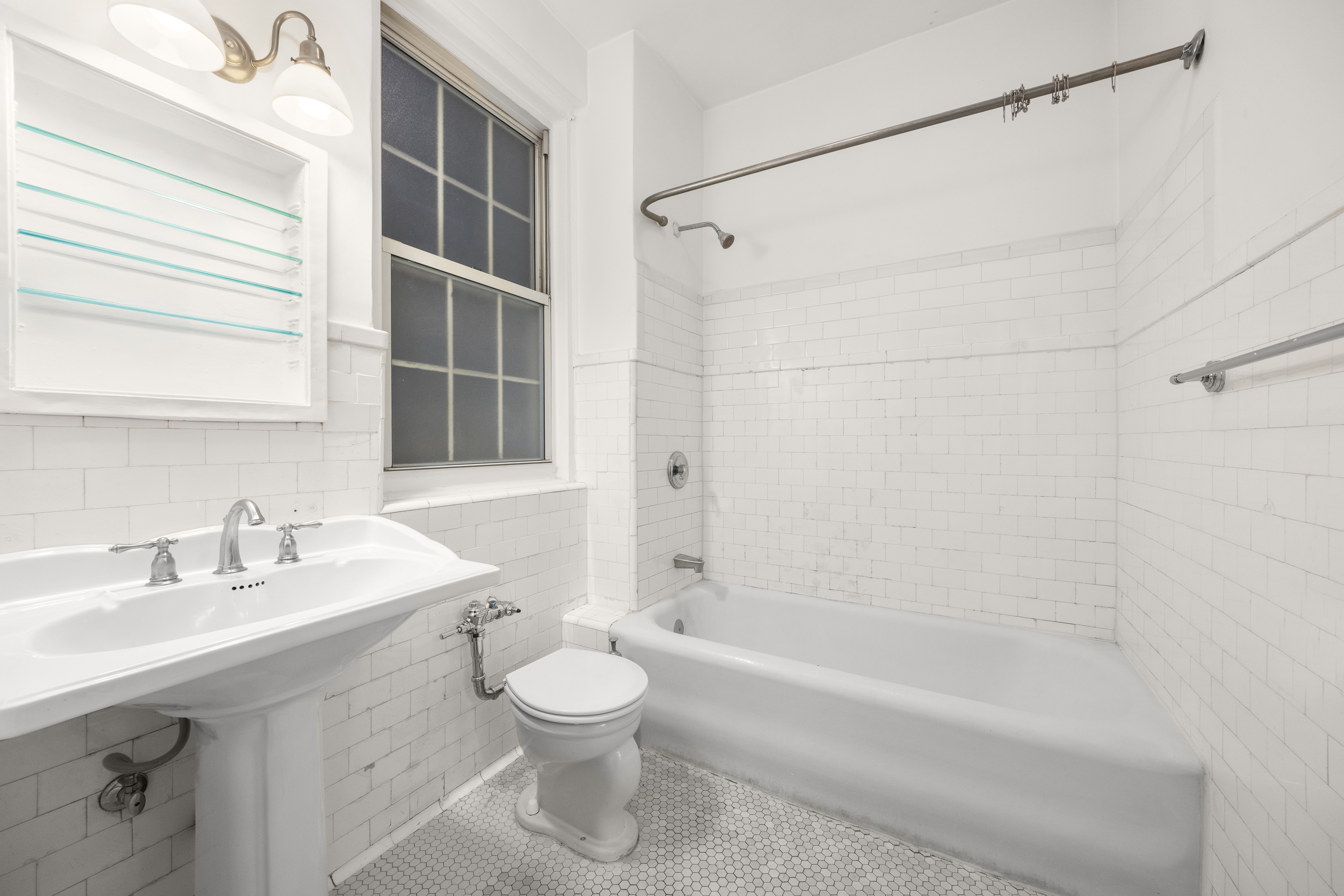 39 5th Avenue, Unit 2B Manhattan, NY 10003 - Photo 8 of 10 a bathroom with a sink toilet and shower