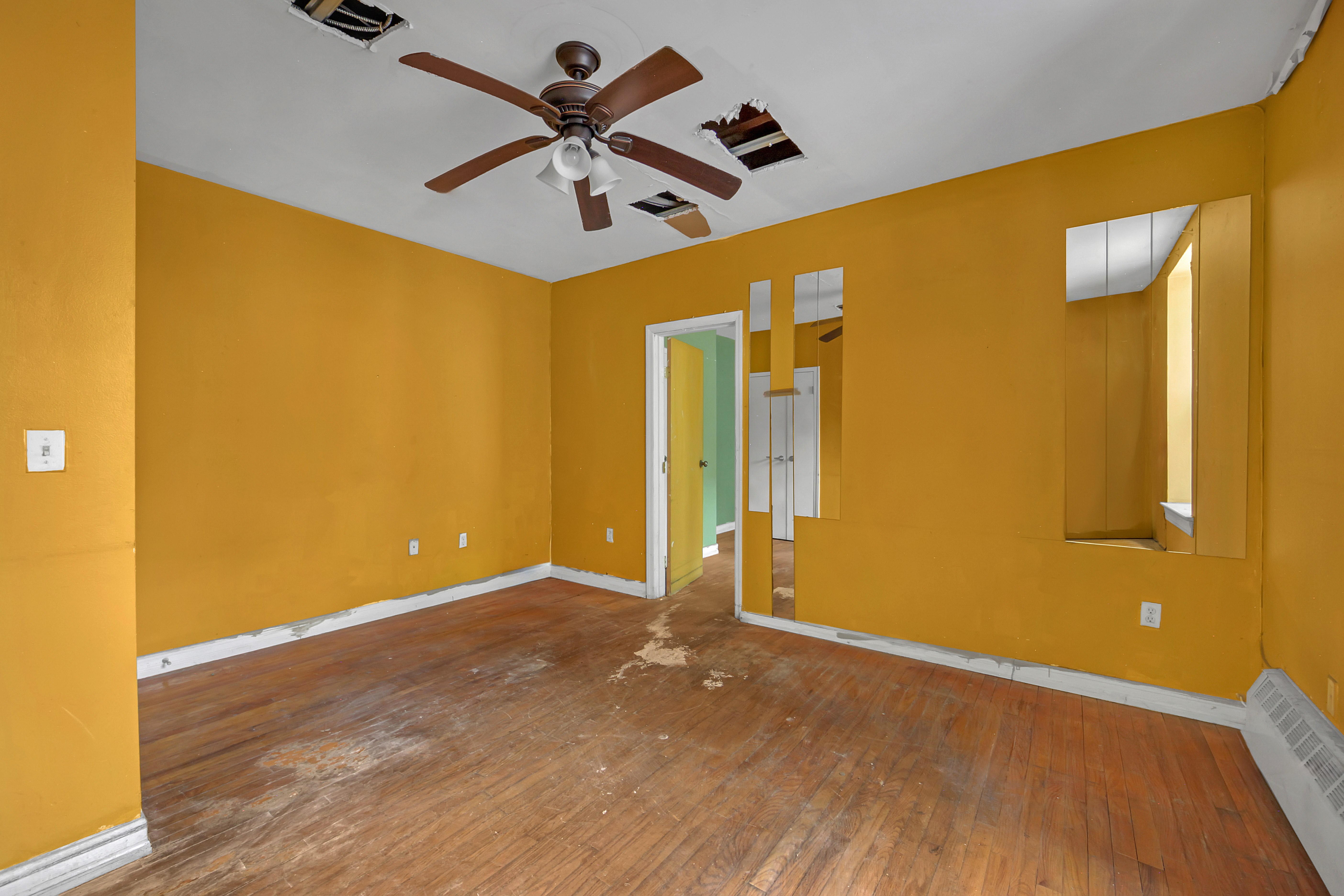430 Lenox Avenue, Unit 1 Manhattan, NY 10037 - Photo 2 of 14 a view of a big room with wooden floor