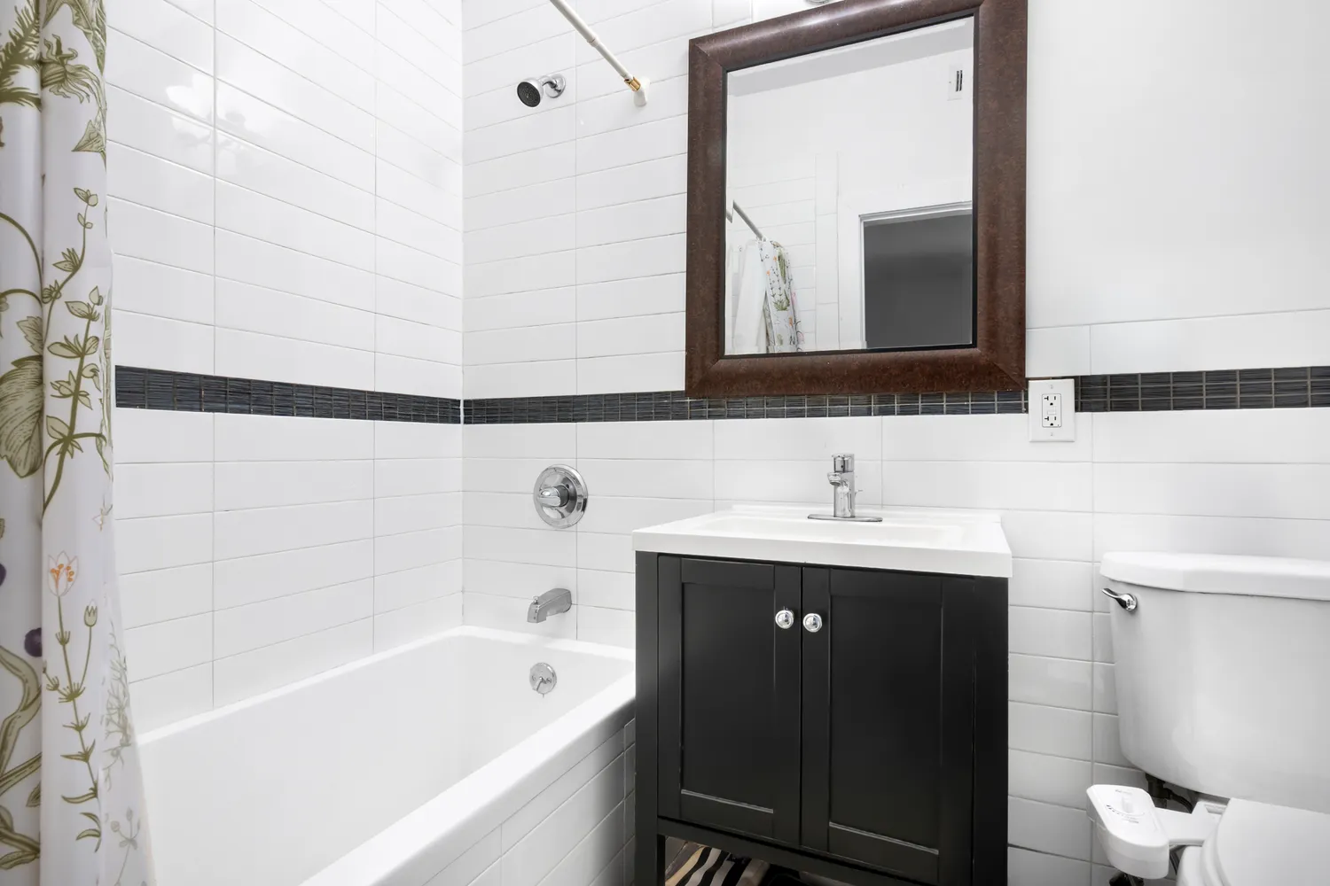a bathroom with a bathtub and a sink