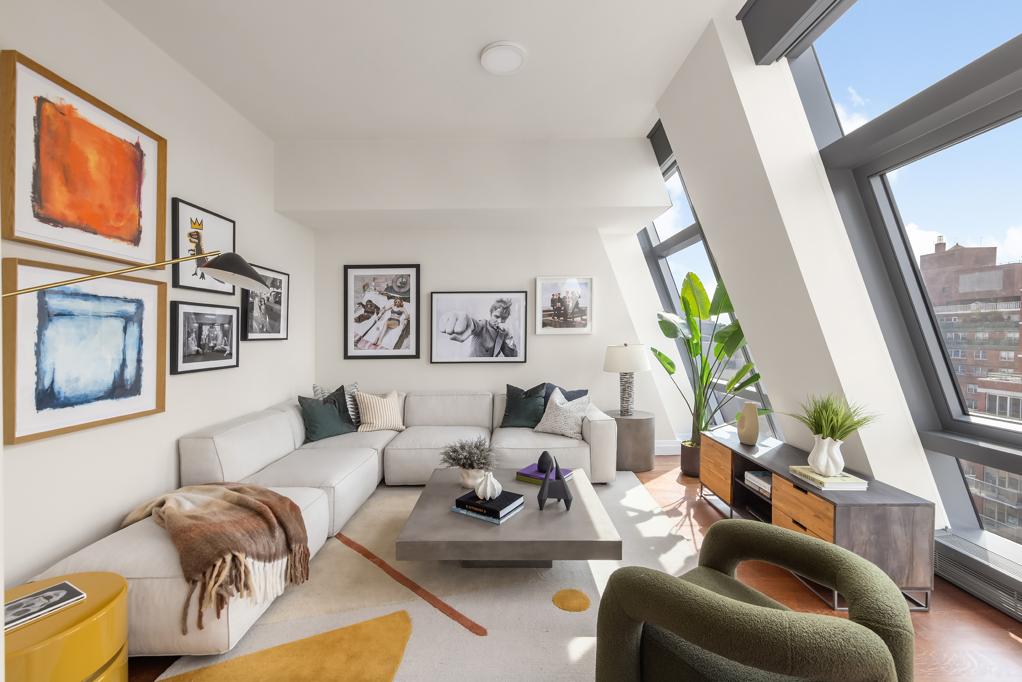 35 West 15th Street, Unit 15D Manhattan, NY 10011 - Photo 2 of 15 a living room with furniture and a flat screen tv