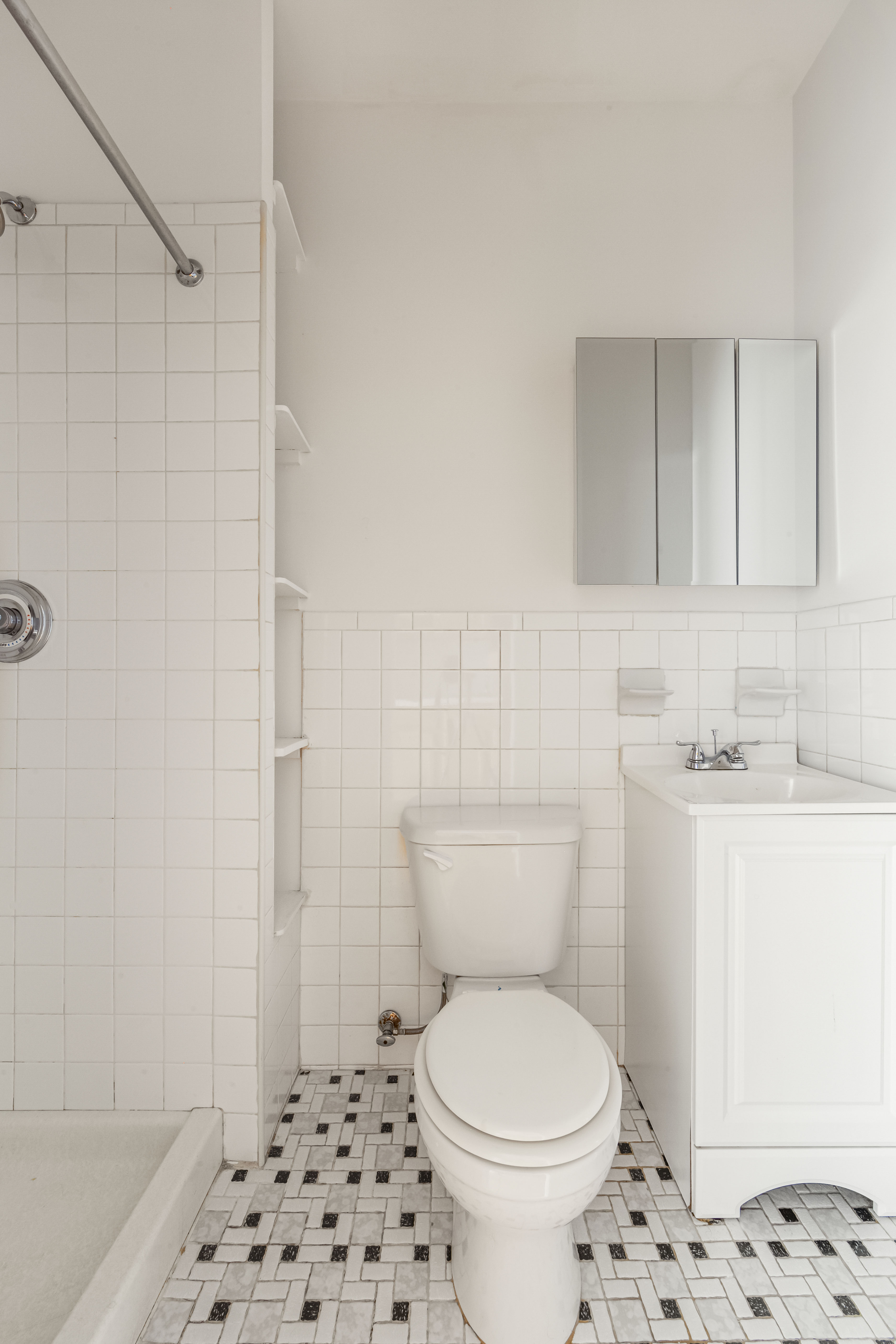 142 Sullivan Street, Unit 12 Manhattan, NY 10012 - Photo 7 of 12 a bathroom with a sink toilet and shower