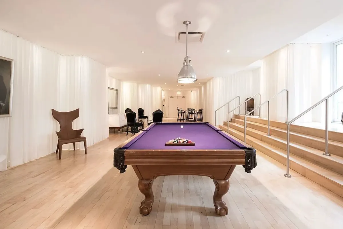 15 Broad Street, Unit 1601 Manhattan, NY 10005 - Photo 12 of 16 a room with furniture pool table and windows