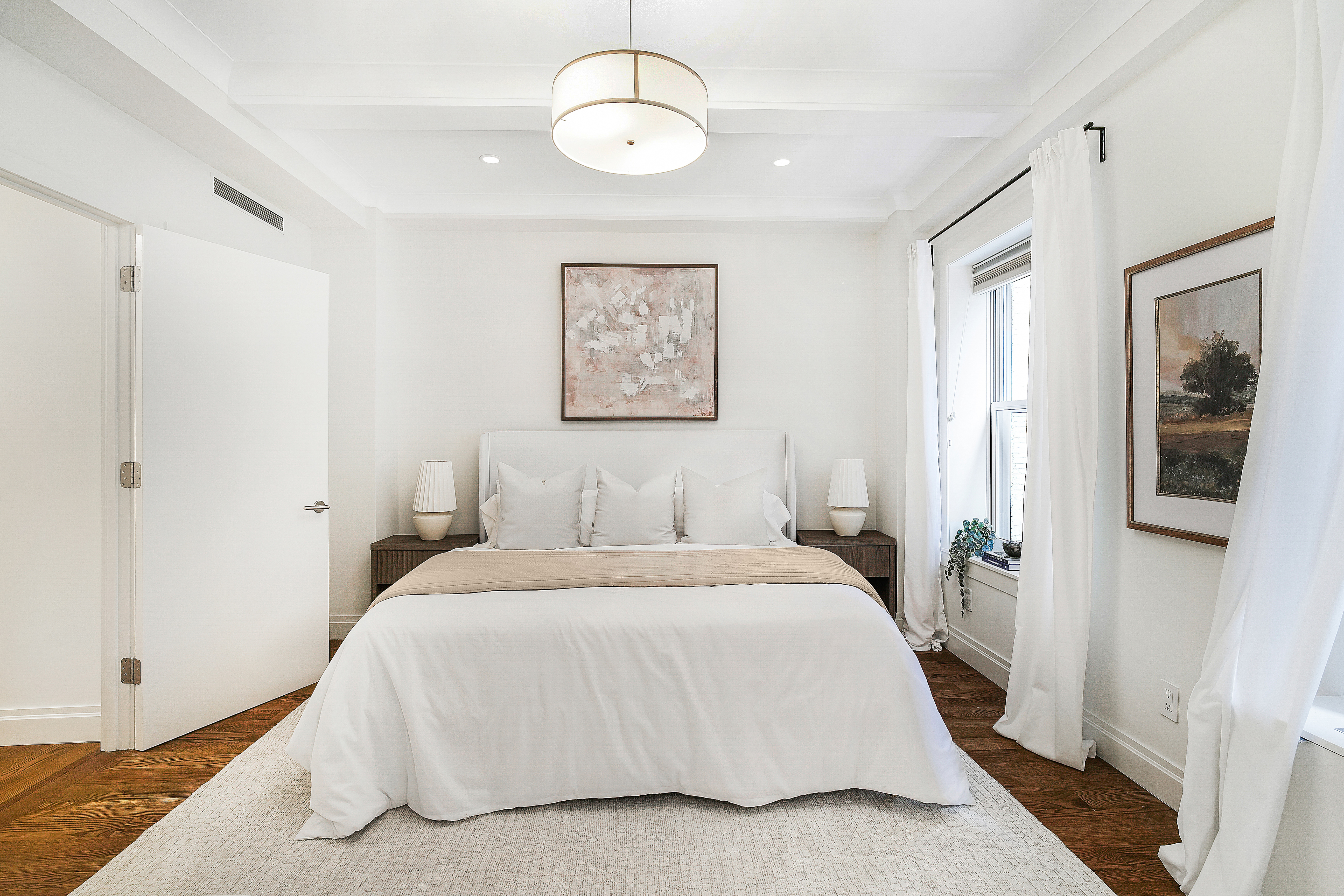 215 West 88th Street, Unit 3E Manhattan, NY 10024 - Photo 4 of 16 a bedroom with a large bed and a window