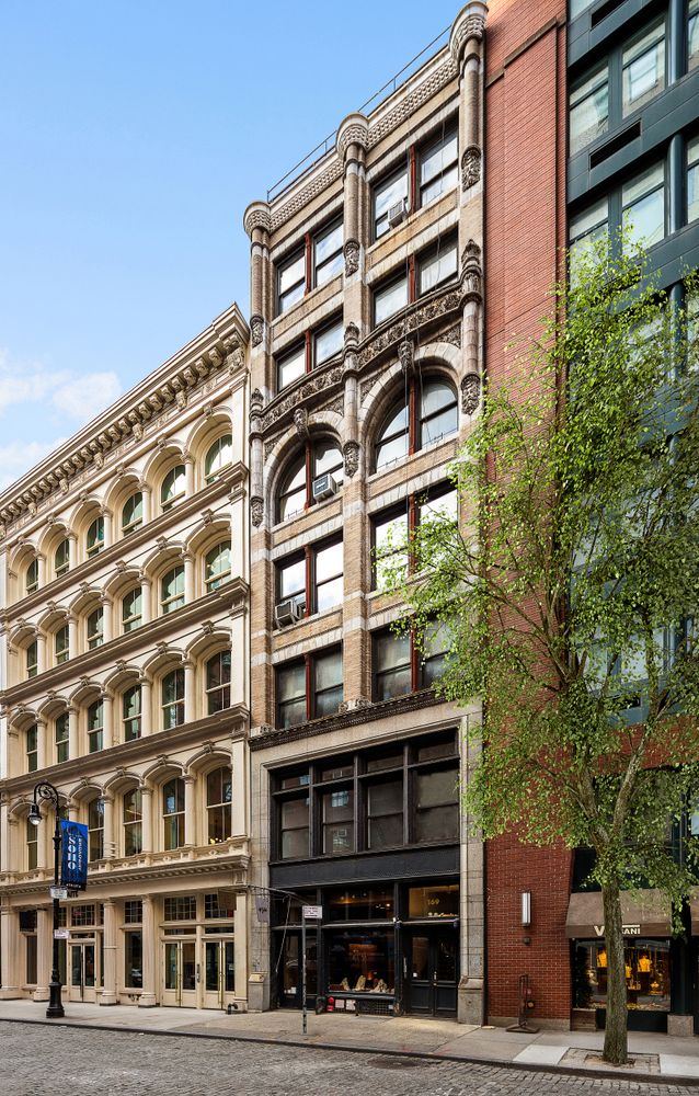 a picture of a bench in front of a white house